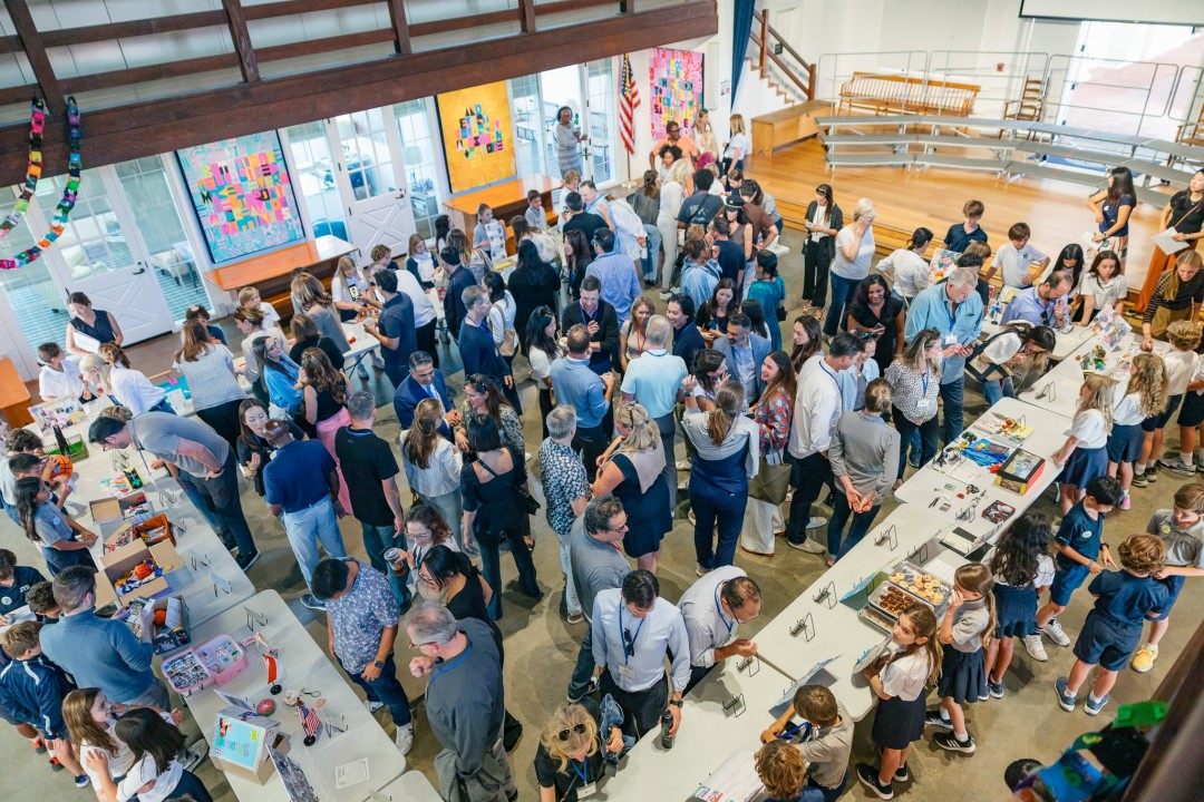 Parents and 4th Grade students gather in John Dye Hall to view student's displays