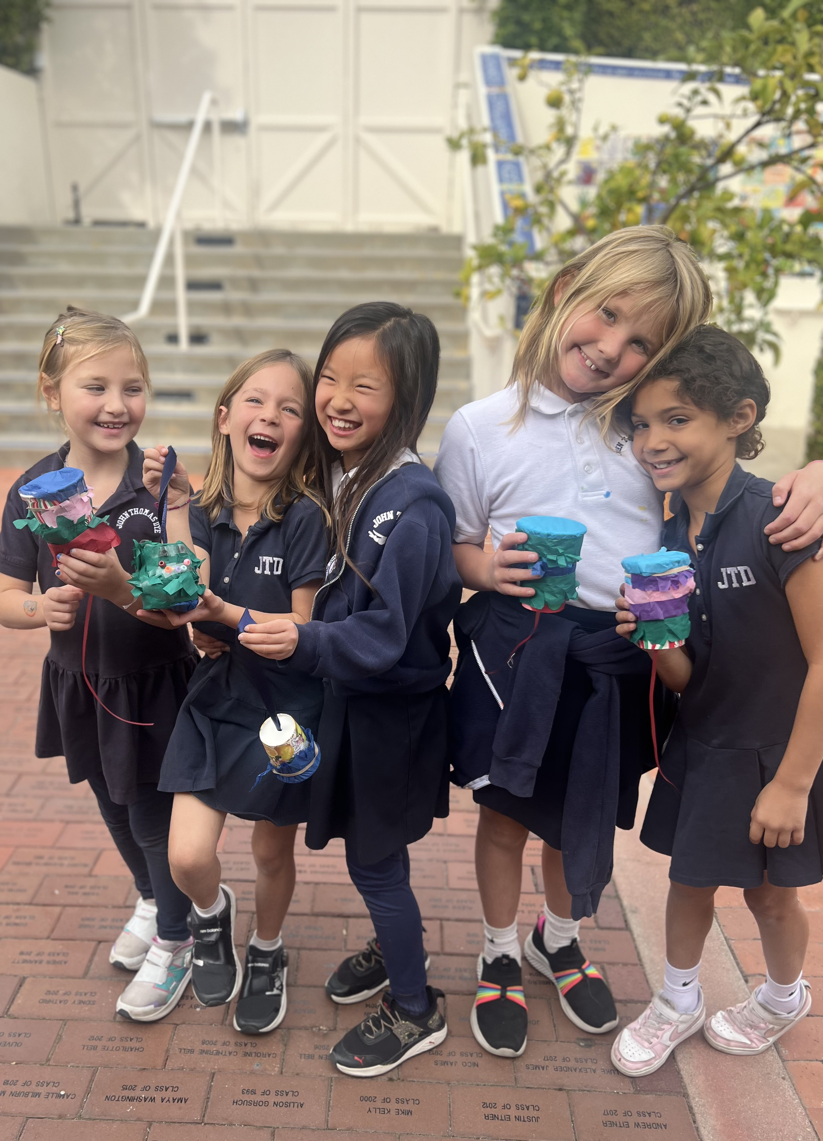 Students stand with crafts they made in Culture Club