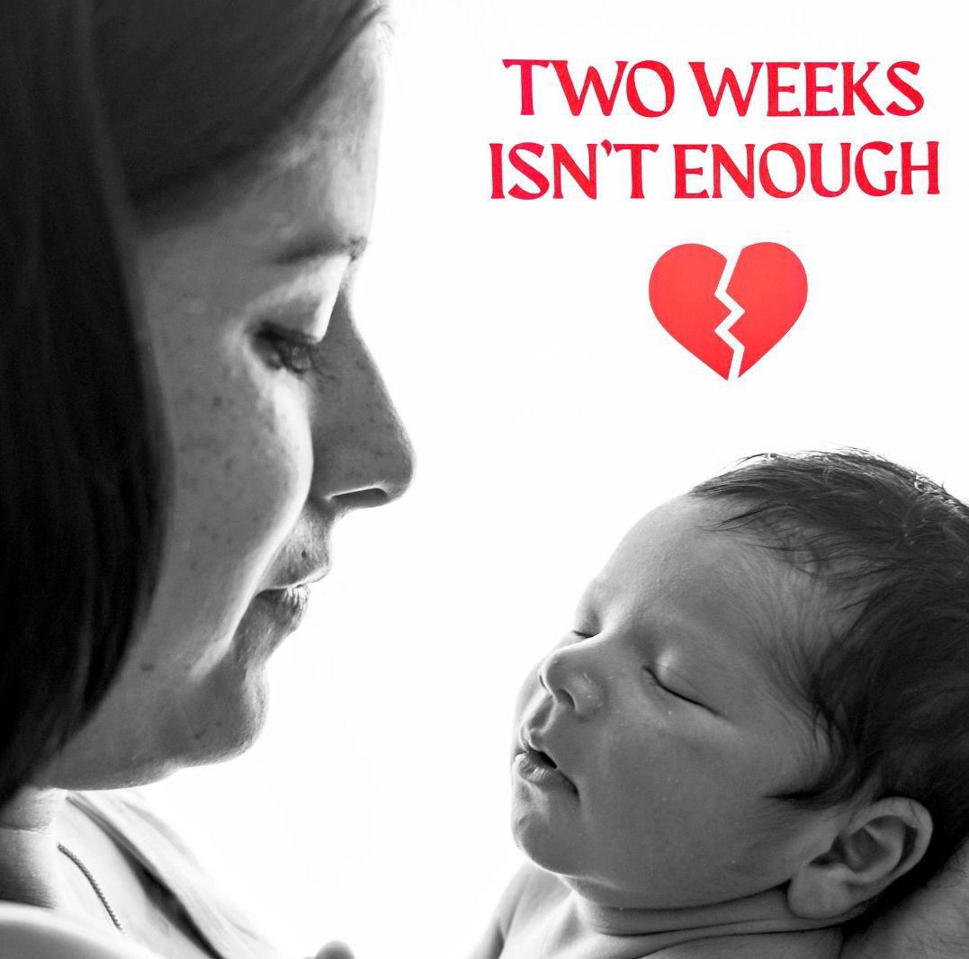 Black-and-white photograph of a mother cradling her newborn baby. Red overlay text reads: “TWO WEEKS ISN’T ENOUGH. The UK’s paternity leave is breaking families apart,” alongside a broken heart icon. The image combines a tender parenting moment with a campaign message calling for longer, better paid paternity leave.