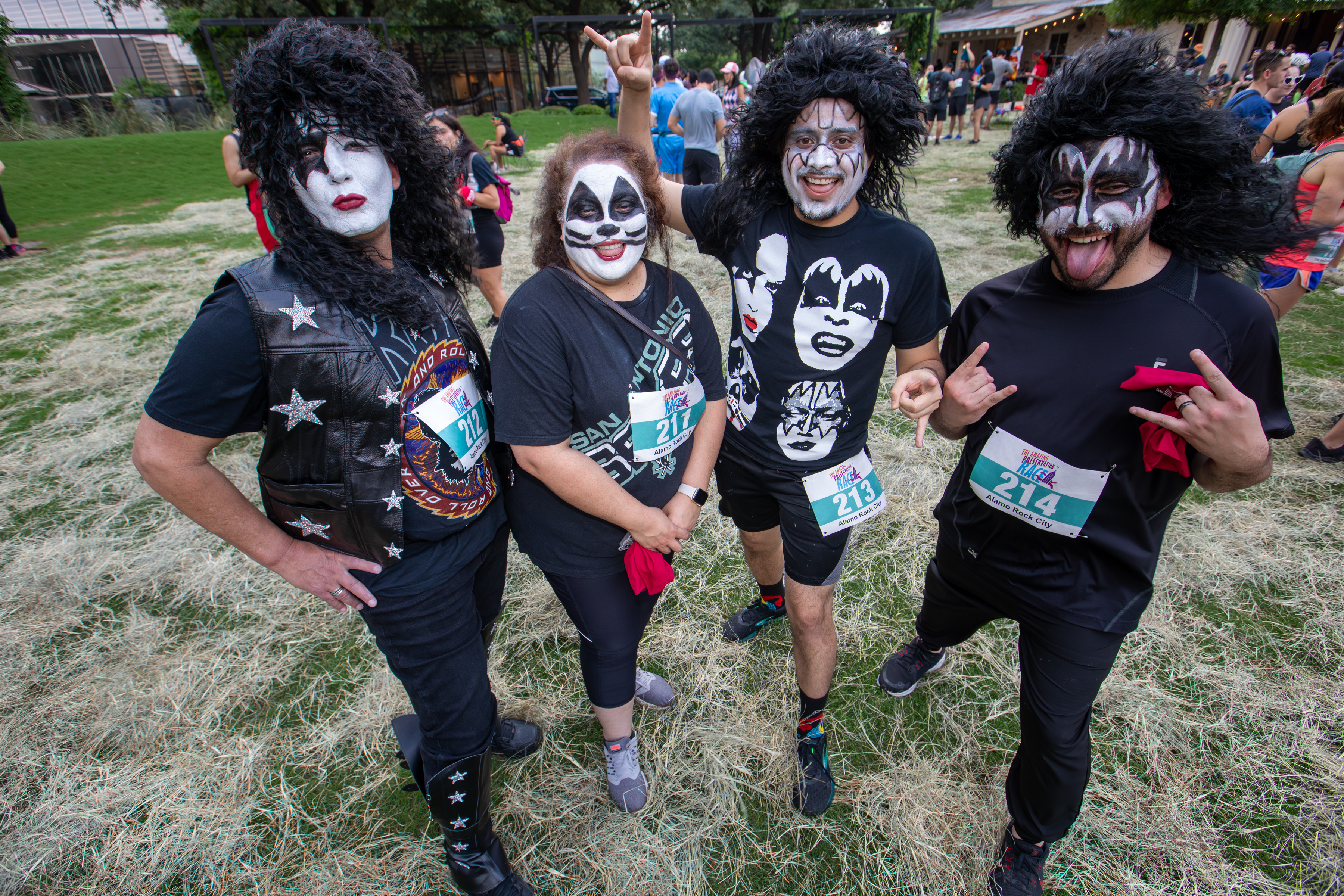 Team of 4 dressed up as Kiss, the band